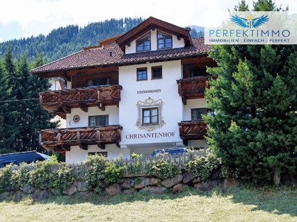 Alpines Wohn- und Apartmenthaus in exklusiver Pistenlage